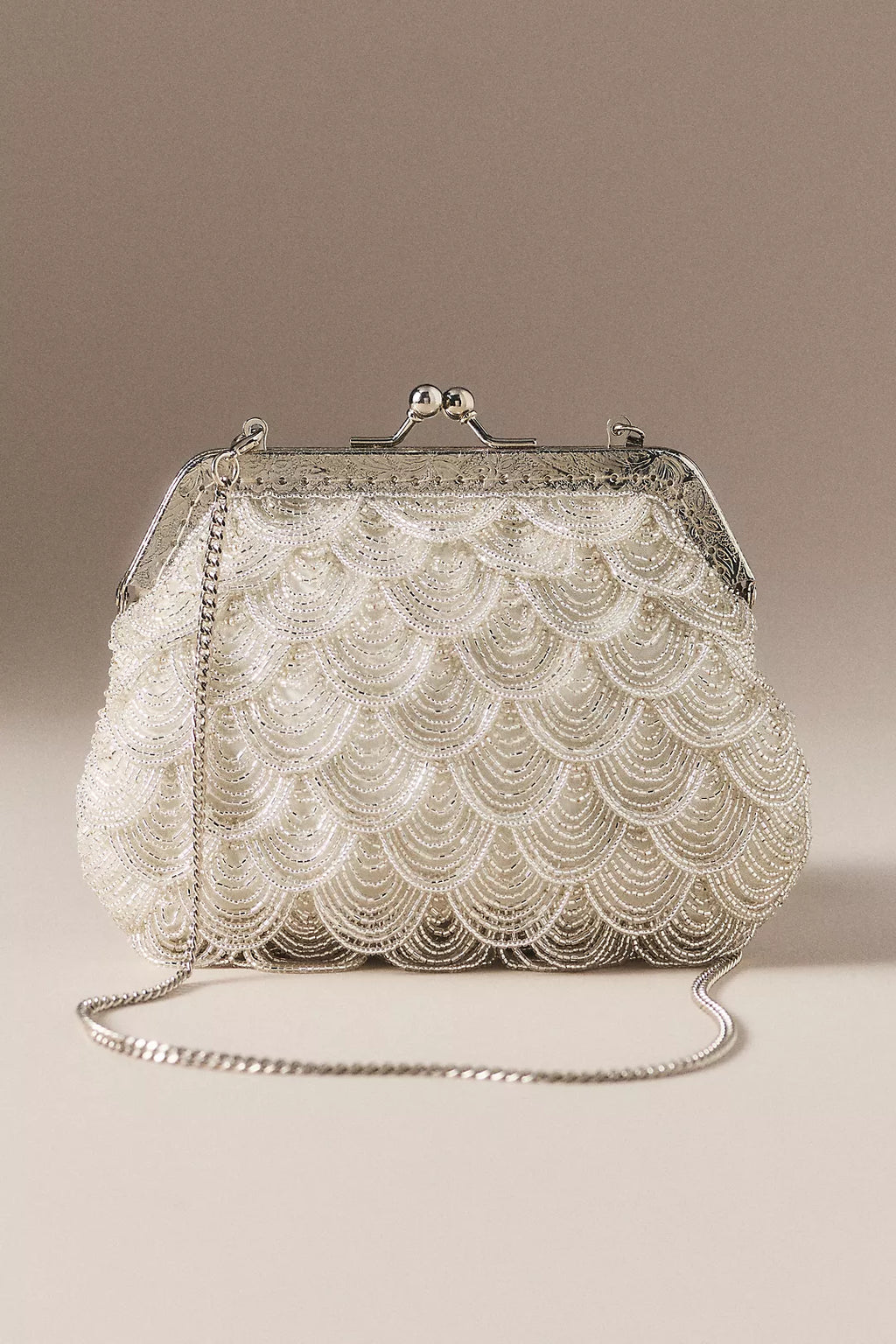 Vintage-style beaded shell-shaped wedding clutch with a kiss-lock clasp