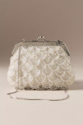 Vintage-style beaded shell-shaped wedding clutch with a kiss-lock clasp