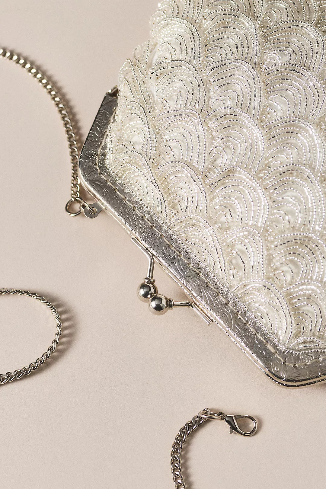 Vintage-style beaded shell-shaped wedding clutch with a kiss-lock clasp