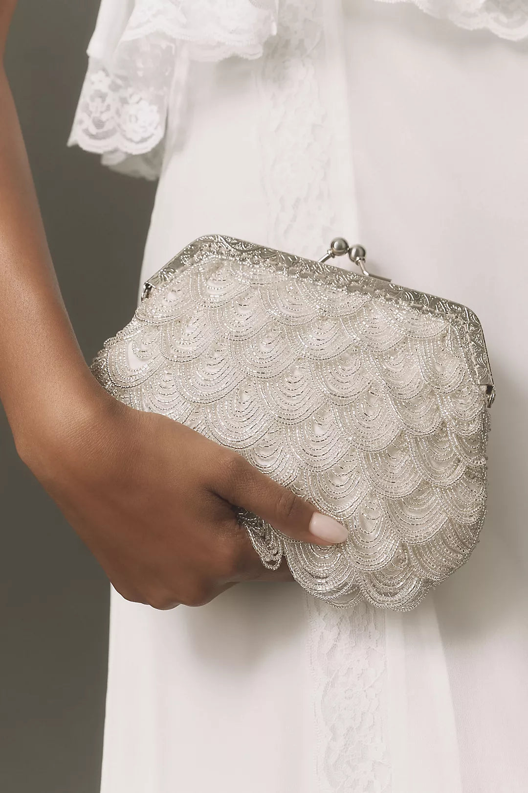 Vintage-style beaded shell-shaped wedding clutch with a kiss-lock clasp