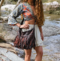 Handmade leather fringe shoulder bag in a vintage Western-Bohemian style.