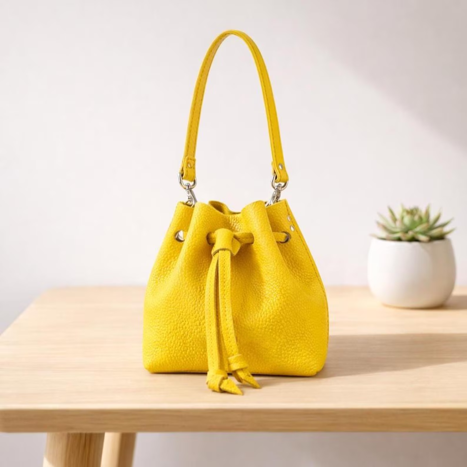 Bright Yellow Pebbled Leather Drawstring Mini Bucket Crossbody Bag