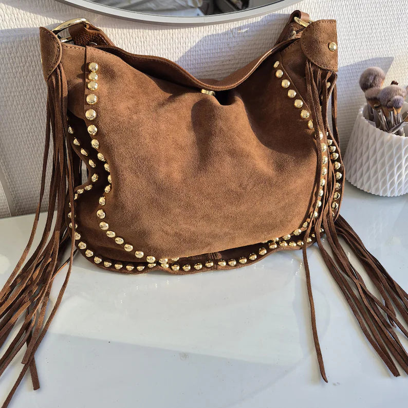 Camel suede shoulder bag with tassels and gold studs.