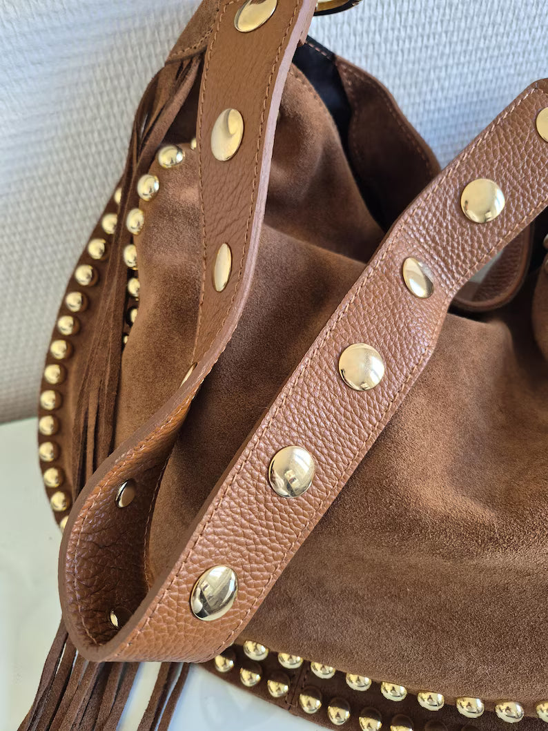 Camel suede shoulder bag with tassels and gold studs.